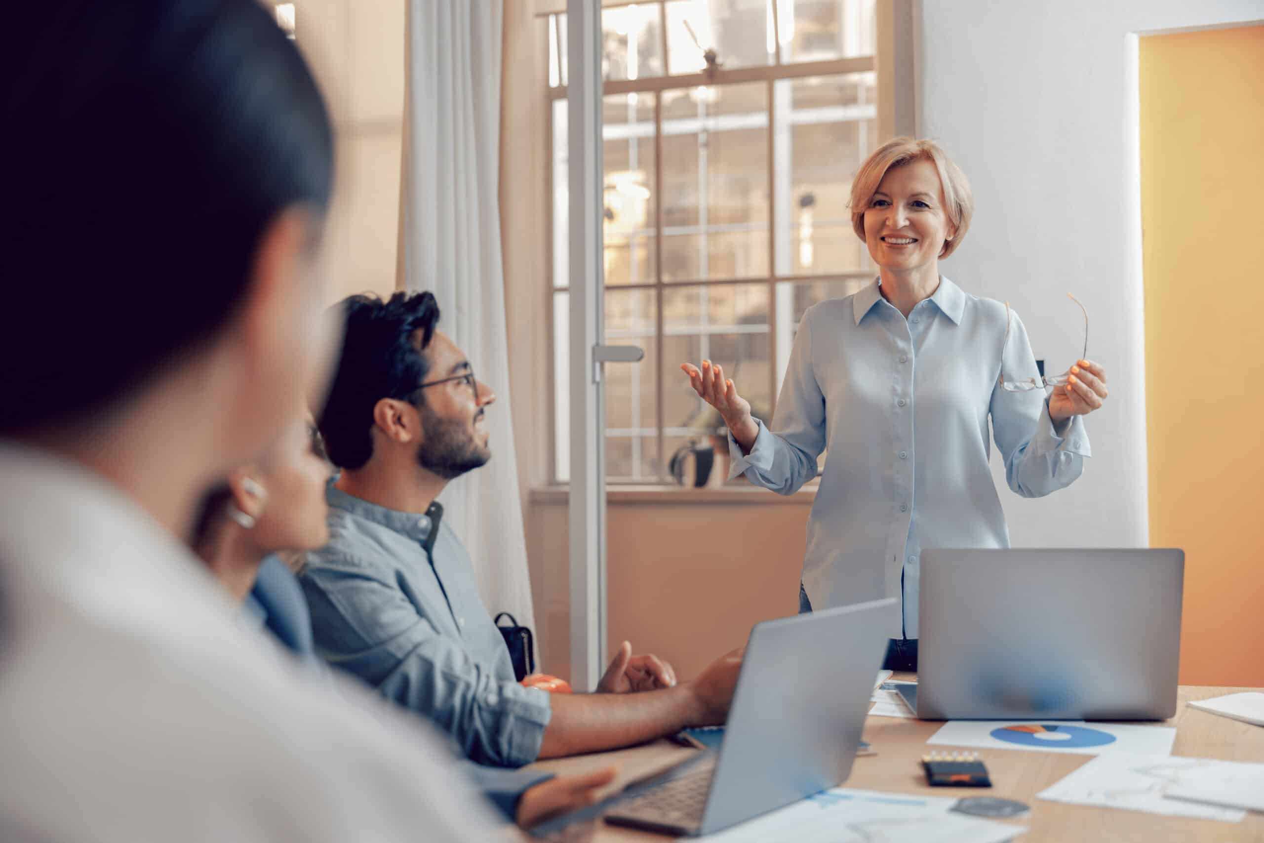 Team of business investors is discussing a new project in modern office. Concept of financing